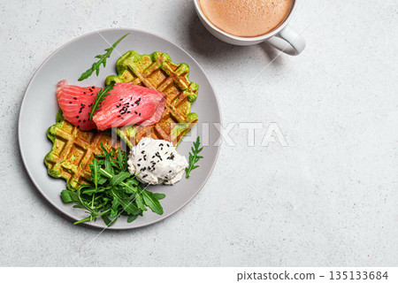 Healthy breakfast with green spinach vegetable waffles, salmon, cream cheese and arugula 135133684