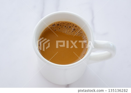 A cafe latte is a coffee with plenty of milk, perfect for a morning drink. 135136282