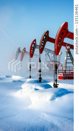Red and white oil pumps extracting fossil fuel fill a snowy winter landscape, with a clear blue sky overhead, highlighting the intersection of energy production and nature 135136461