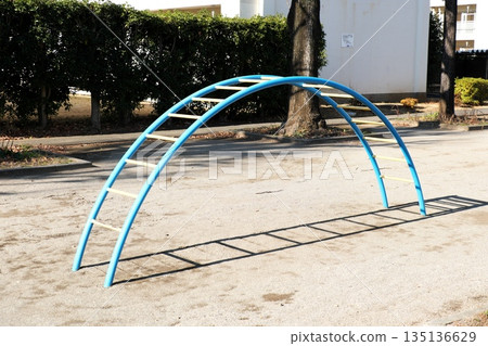 Scenery with playground equipment in the park 135136629