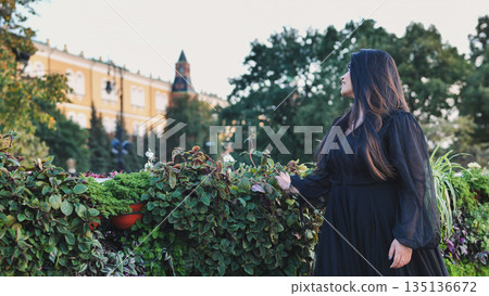 Bangladeshi woman travelling in Moscow, enjoying the park scenery and urban architecture Bangladeshi woman travelling in Moscow, enjoying the park scenery and urban architecture 135136672