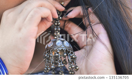 Bangladeshi girl wearing jhumka earring, representing South Asian culture in Moscow Bangladeshi girl wearing jhumka earring, representing South Asian culture in Moscow 135136705