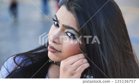 Bangladeshi young woman with blue eyeliner posing outdoors in Moscow 135136757