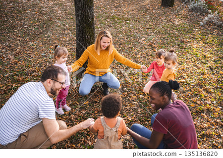 Circle of Fun: Family and Friends Enjoying Autumn Together Circle of Fun: Family and Friends Enjoying Autumn Together 135136820