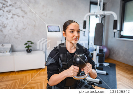 Electro muscle stimulation training at a gym 135136842