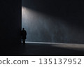 Lonely Figure In Shadowy Space Beside A Dark Wall With A Beam Of Light 135137952