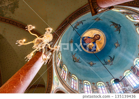 The interior of The Church of St. George in Cairo, Egypt. Drawing of Jesus under the ceiling. Coptic Cairo. Orthodox churches in Egypt. The interior of The Church of St. George in Cairo, Egypt. Drawing of Jesus under the ceiling. Coptic Cairo. Orthodox churches in Egypt. 135139436