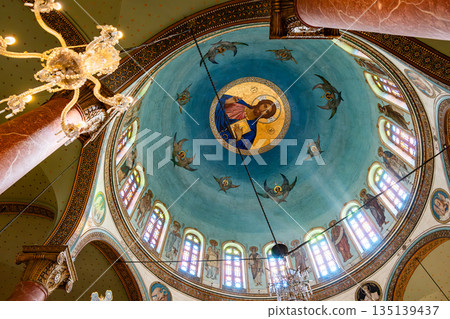 The interior of The Church of St. George in Cairo, Egypt. Drawing of Jesus under the ceiling. Coptic Cairo. Orthodox churches in Egypt. The interior of The Church of St. George in Cairo, Egypt. Drawing of Jesus under the ceiling. Coptic Cairo. Orthodox churches in Egypt. 135139437