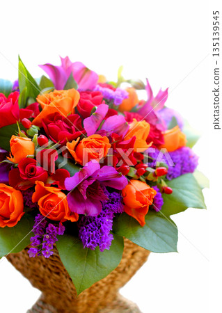 Colorful flower arrangement with orange roses Colorful flower arrangement with orange roses 135139545