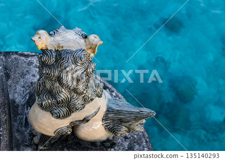Okinawa's Shisa and emerald blue sea 135140293