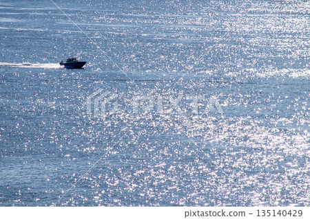 A ship sailing on the sparkling sea surface 135140429