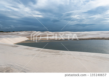Dunes and lagoons of lagoa bonita, Lencois Maranhenses, Barreirinhas, Brazil. White sand dunes with pools of fresh water Dunes and lagoons of lagoa bonita, Lencois Maranhenses, Barreirinhas, Brazil. White sand dunes with pools of fresh water 135140657