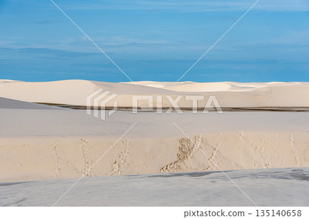 Dunes and lagoons of lagoa bonita, Lencois Maranhenses, Barreirinhas, Brazil. White sand dunes with pools of fresh water Dunes and lagoons of lagoa bonita, Lencois Maranhenses, Barreirinhas, Brazil. White sand dunes with pools of fresh water 135140658
