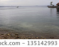 A view from Cebu Island with a rocky beach, sea, boats, islands and sky A view from Cebu Island with a rocky beach, sea, boats, islands and sky 135142993