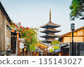 Traditional Japanese street scene with a pagoda in the background. Kyoto 135143027