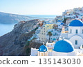Oia Santorini Greece: Iconic blue domed churches and whitewashed houses on the caldera 135143030