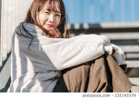 Women sitting on the stairs 135143379