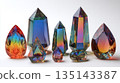 A captivating still life of faceted crystals, showcasing an array of colors and shapes. The arrangement is set against a clean, white backdrop, accentuating their brilliance. 135143387