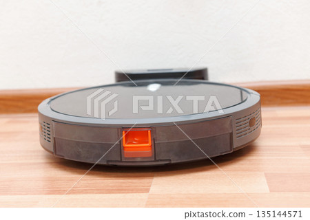 Robot vacuum cleaner go to charging dock after it is finished. Robotic Vacuum Robot vacuum cleaner go to charging dock after it is finished. Robotic Vacuum 135144571