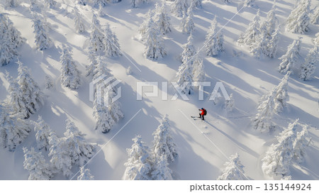 Beautiful Winter Mountain Scenery with Man on Cross-Country Skis , Aerial View Beautiful Winter Mountain Scenery with Man on Cross-Country Skis , Aerial View 135144924