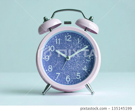 Metal violet alarm. Purple vintage alarm clock on background in pastel color with copy space. Bright design. Metal violet alarm. Purple vintage alarm clock on background in pastel color with copy space. Bright design. 135145199