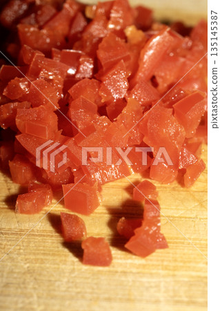 Cllose up of chopped red shilli cut on a chopping board Cllose up of chopped red shilli cut on a chopping board 135145387