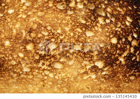 A Close Up of a Toasted Home Made Bread Slice Toast Showing Texture A Close Up of a Toasted Home Made Bread Slice Toast Showing Texture 135145410