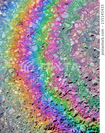 Oil Petrol Rainbow Leak Running over the road tarmac Oil Petrol Rainbow Leak Running over the road tarmac 135145435