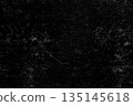 Grunge texture with scratches and scuffs on a black background 135145618