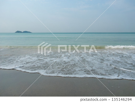 Serene Morning Wave Gently Laps Quiet Sandy Beach Shore. Serene Morning Wave Gently Laps Quiet Sandy Beach Shore. 135146294