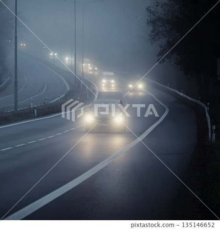 Bad weather driving foggy hazy country road. Motorway road traffic. Winter time 135146652