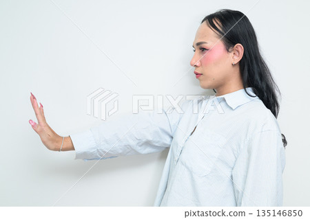 Profile view portrait of a young Thai transgender business person against white background Profile view portrait of a young Thai transgender business person against white background 135146850