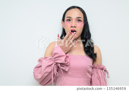 Portrait of a young Thai transgender person against white background shocked and surprised Portrait of a young Thai transgender person against white background shocked and surprised 135146959