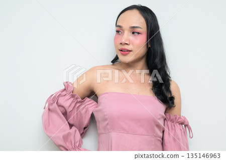 Portrait of a young Thai transgender person against white background thinking Portrait of a young Thai transgender person against white background thinking 135146963