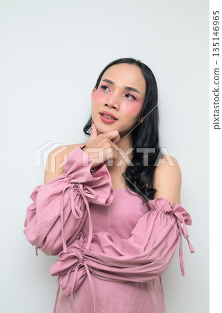 Portrait of a young Thai transgender person against white background thinking Portrait of a young Thai transgender person against white background thinking 135146965