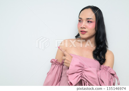 Portrait of a young Thai transgender person against white background pointing finger 135146974