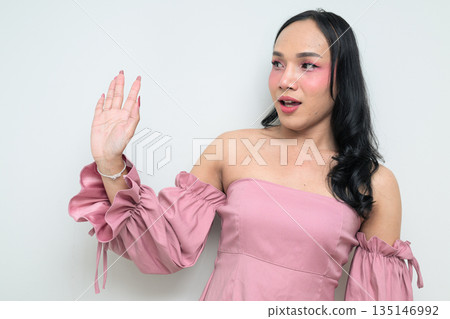 Portrait of a young Thai transgender person against white background 135146992