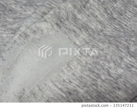Photo of fabric that is worn out and about to develop holes (left side) 135147211