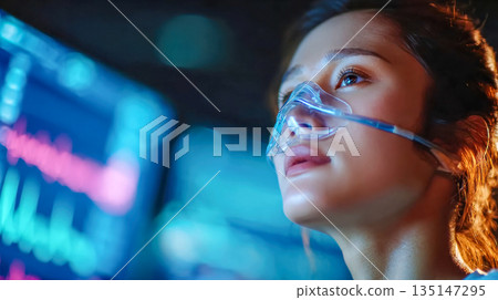 Cinematic close-up portrait of a woman wearing an oxygen mask, highlighting respiratory therapy and medical treatment 135147295
