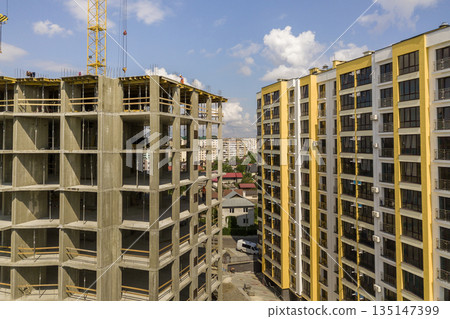 Apartment or office tall concrete building under construction. 135147399