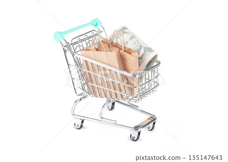 Shopping cart filled with paper bags 135147643