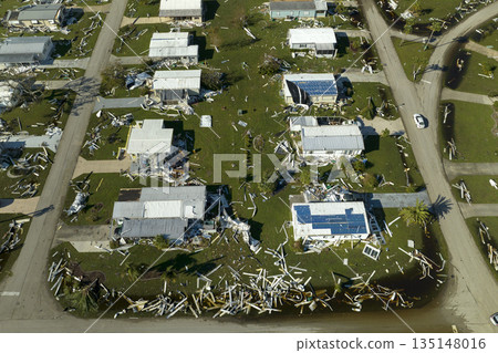 Aerial view of natural disaster consequences. Severely damaged by hurricane Ian mobile homes in Florida residential area Aerial view of natural disaster consequences. Severely damaged by hurricane Ian mobile homes in Florida residential area 135148016