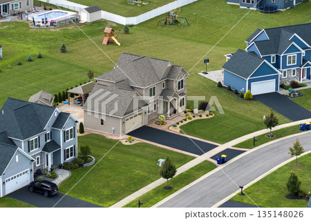 Aerial view of large private homes in Rochester, NY residential area. New family houses as example of real estate development in american suburbs Aerial view of large private homes in Rochester, NY residential area. New family houses as example of real estate development in american suburbs 135148026