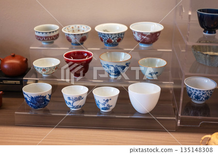 Variety Of Traditional Teacups Displayed In A Charming Setup Variety Of Traditional Teacups Displayed In A Charming Setup 135148308