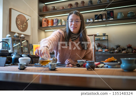 Enjoying Tea In A Cozy Setting With Friends And Family 135148324