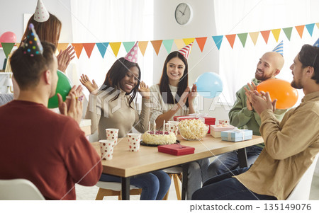 Portrait of friends group celebrating Birthday party sitting at festive table at home 135149076