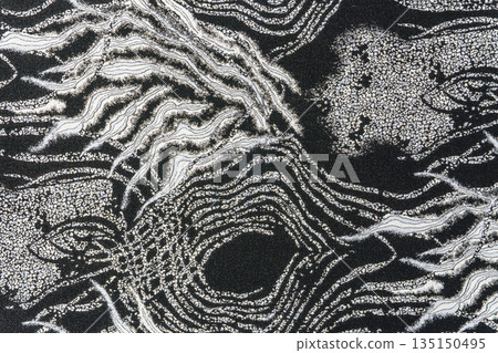 Dark grey jacquard fabric texture with metallic lurex and abstract wave pattern, part of textile collection Dark grey jacquard fabric texture with metallic lurex and abstract wave pattern, part of textile collection 135150495