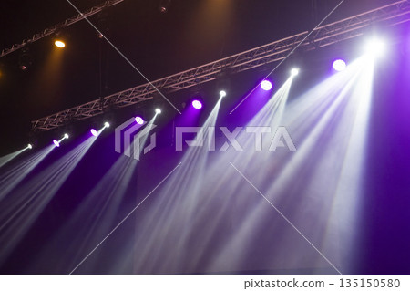 Light from stage lighting equipment in a concert hall Light from stage lighting equipment in a concert hall 135150580