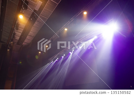 Light from stage lighting equipment in a concert hall Light from stage lighting equipment in a concert hall 135150582