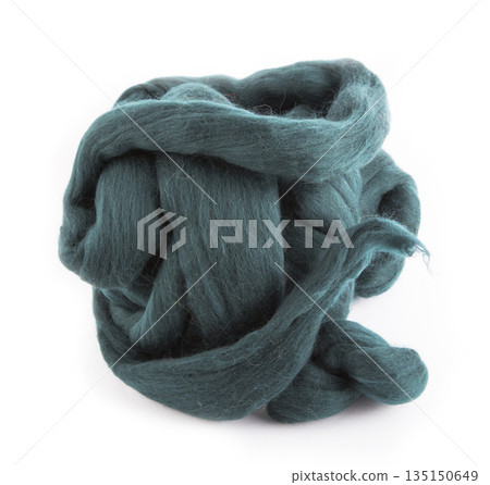 Skein of merino wool dark green on a white background Skein of merino wool dark green on a white background 135150649